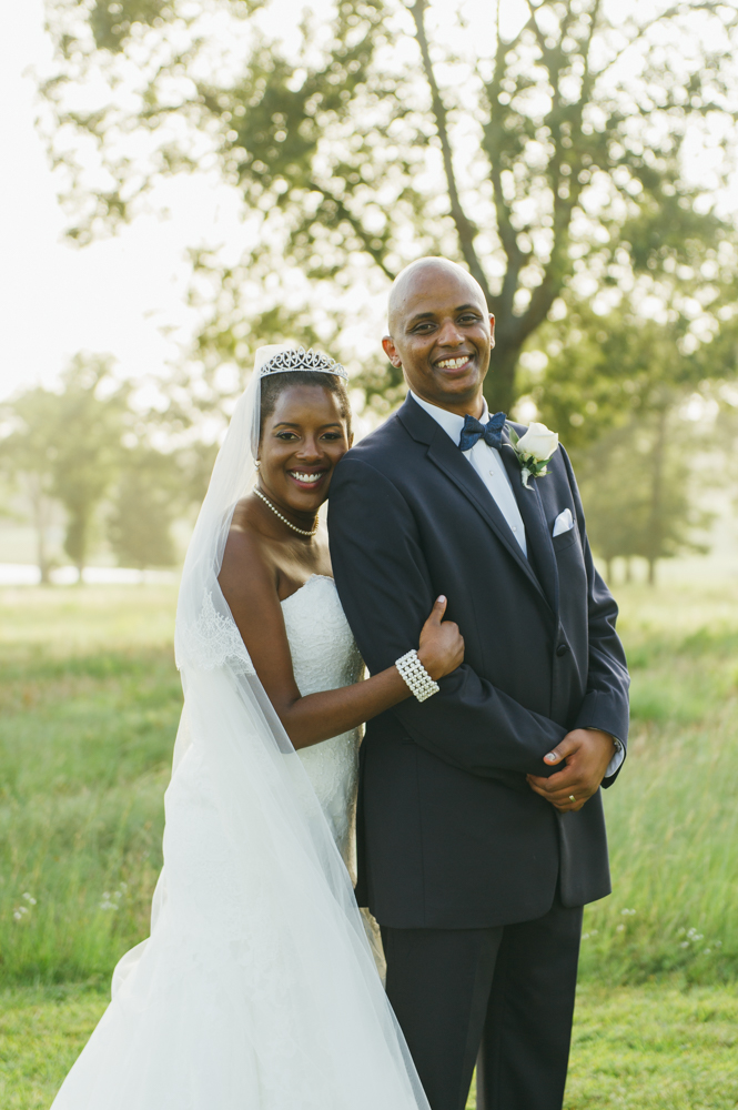Bride stands behind the groom with her cheek resting on his shoulder and her hand on his arm. They are both smiling at the camera.

Luxury Texas Wedding Photographer. Timeless Wedding Photography. Wedding in Texas. Destination Wedding Photographer.