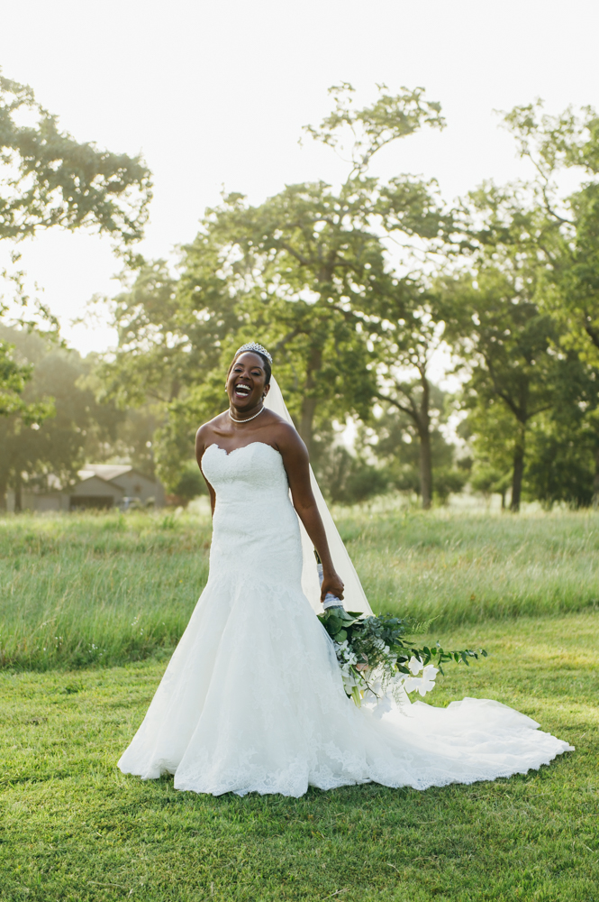 Bride stands in a grassy field and smiles a big smile with her bouquet down at her side.

Luxury Texas Wedding Photographer. Timeless Wedding Photography. Wedding in Texas. Destination Wedding Photographer.