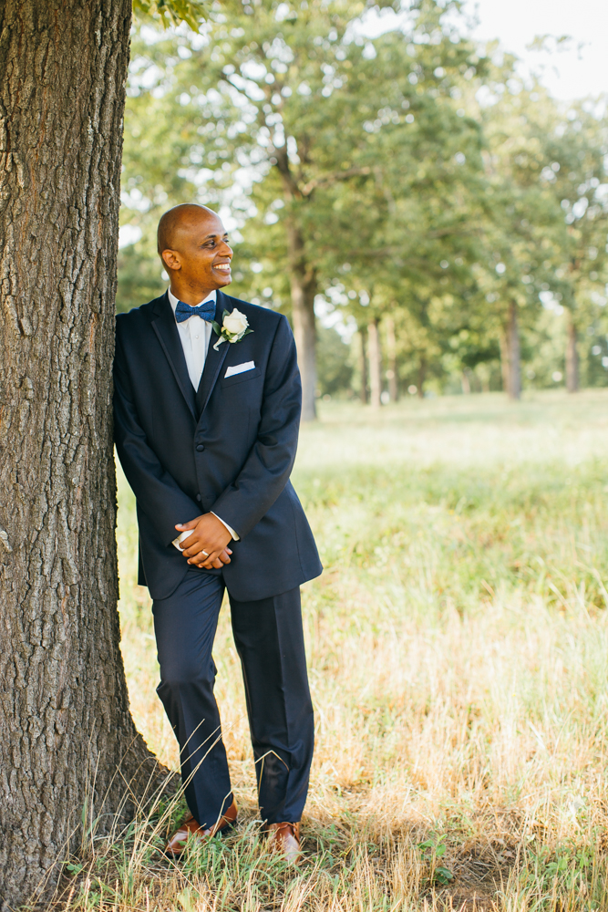 Groom leans against a tree in a grassy field and smiles off to the side.

Luxury Texas Wedding Photographer. Timeless Wedding Photography. Wedding in Texas. Destination Wedding Photographer.
