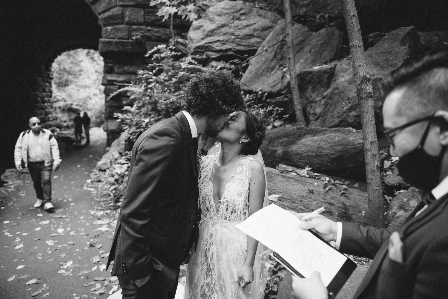 Bride and groom kiss beside rocks in Central Park. 

Central Park Wedding Photography. Williamsburg Bridge Bridal Portraits. Luxury NYC Wedding Photographer. Manhattan Micro Wedding.