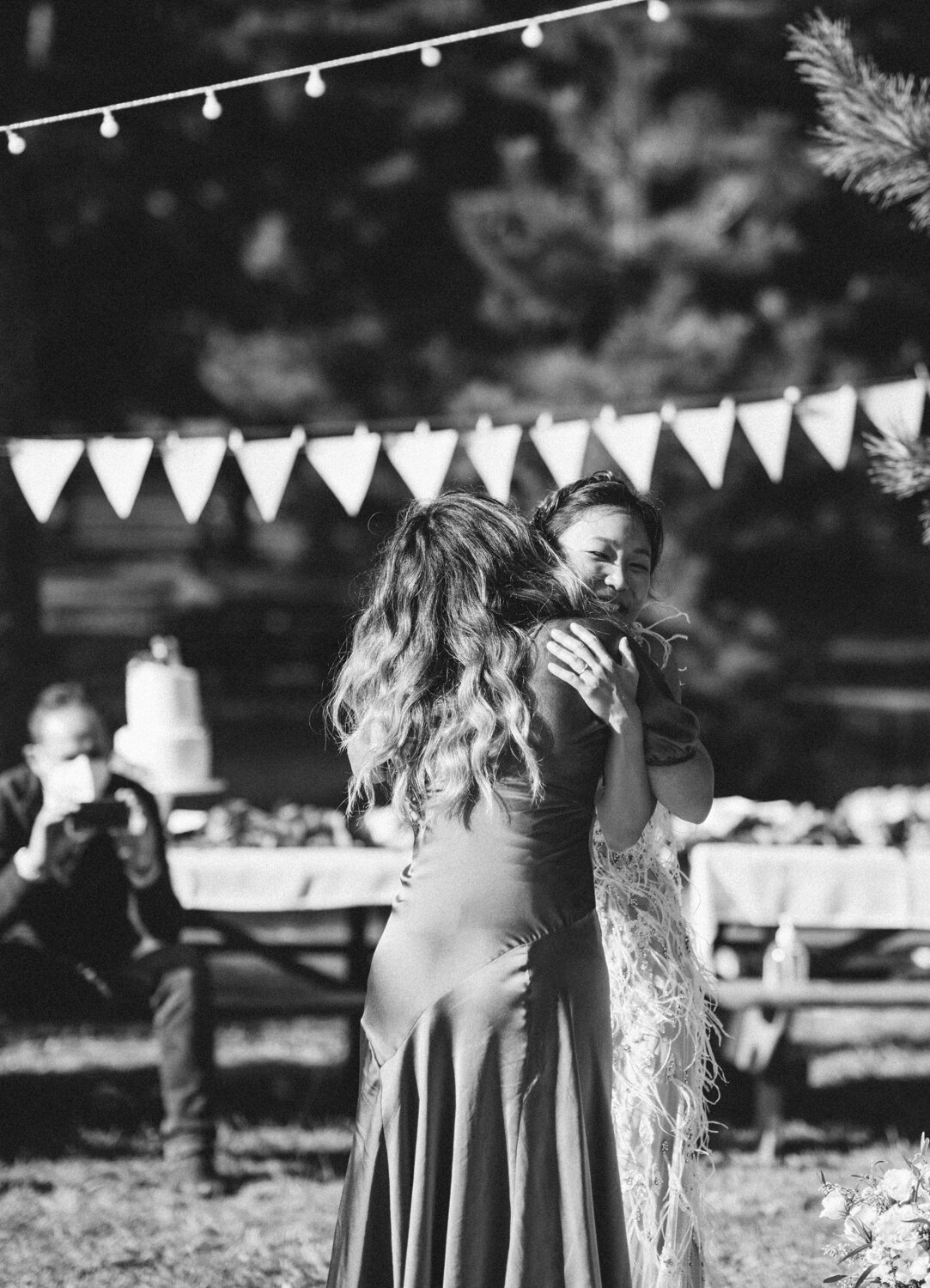 Bride stands and hugs a wedding guest.

Central Park Wedding Photography. Williamsburg Bridge Bridal Portraits. Luxury NYC Wedding Photographer. Manhattan Micro Wedding.