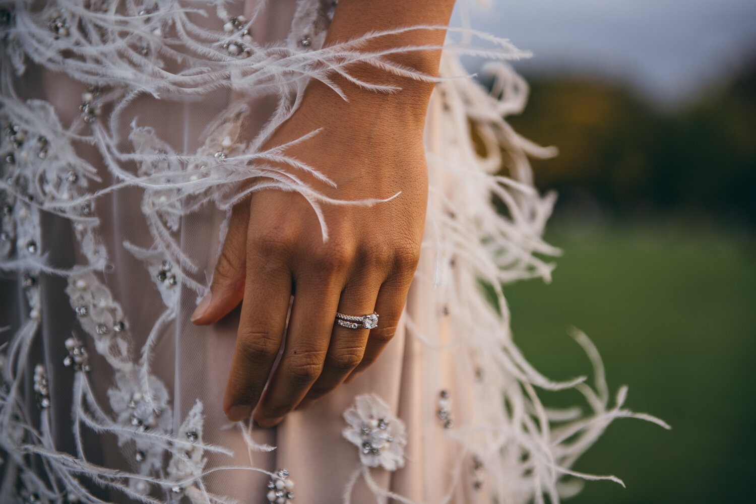 Close-up image of a hand with a wedding ring on it and a feathery dress blowing in the wind.

Central Park Wedding Photography. Williamsburg Bridge Bridal Portraits. Luxury NYC Wedding Photographer. Manhattan Micro Wedding.