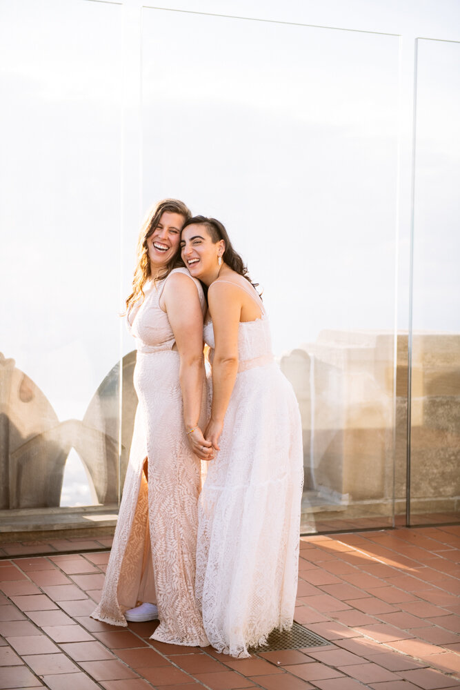 One bride stands behind the other with her head on her shoulder. They are holding hands and smiling.

Luxury NYC Wedding Photography. Queer Wedding Photography. Inclusive Wedding Photographer. LGBTQ+ Manhattan Wedding.