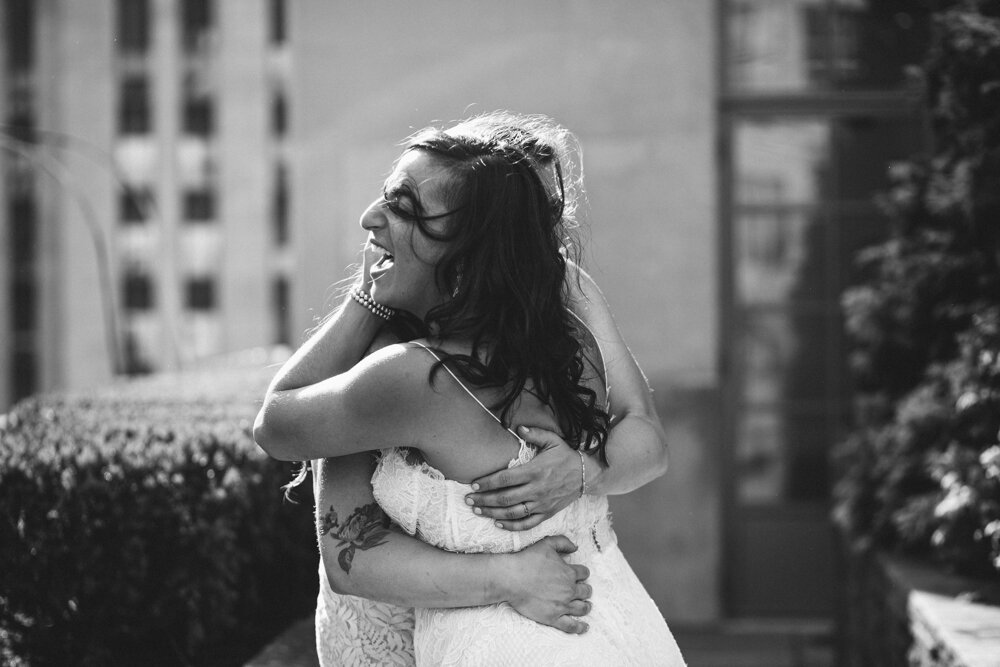 Two brides hug each other with big smiles on their faces. They are standing at Top of the Rock.

Luxury NYC Wedding Photography. Queer Wedding Photography. Inclusive Wedding Photographer. LGBTQ+ Manhattan Wedding.