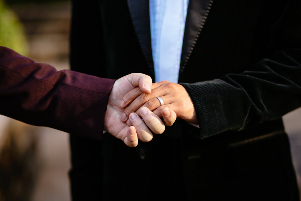 Closeup image of grooms holding hands with wedding ring on display.

Luxury NYC Wedding Photography. Queer Wedding Photography. Inclusive Wedding Photographer. LGBTQ+ Manhattan Wedding.