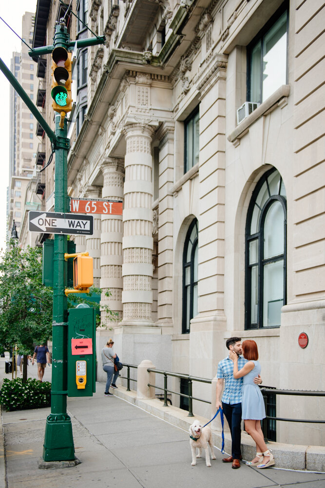 Man and woman kiss on a street corner in Manhattan with their white fluffy dog beside them.

Central Park Engagement Portraits. Manhattan Engagement Photography. NYC Engagement Photographer.