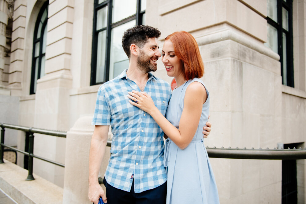 Man and woman stand next to each other on a Manhattan street corner. They are both smiling as he has his arm on her back and she has her hand on his chest.

Central Park Engagement Portraits. Manhattan Engagement Photography. NYC Engagement Photographer.