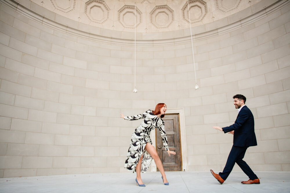 Man and woman are in dancing poses in the bandshell in Central Park in Manhattan. They are looking at each other and smiling.

Central Park Engagement Portraits. Manhattan Engagement Photography. NYC Engagement Photographer.