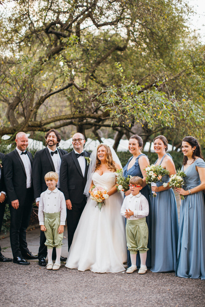Bride, groom, their bridal party, and the two ring bearers all stand together and smile at the camera.

Luxury Local Wedding NYC. Wedding in Manhattan. New York City Wedding Photographer. Manhattan Luxury Wedding Photography. Museum of the City of New York Weddings.