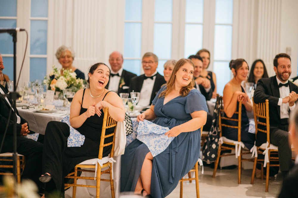 Seated wedding guests all look in the same direction with smiles on their faces.

Luxury Local Wedding NYC. Wedding in Manhattan. New York City Wedding Photographer. Manhattan Luxury Wedding Photography. Museum of the City of New York Weddings.