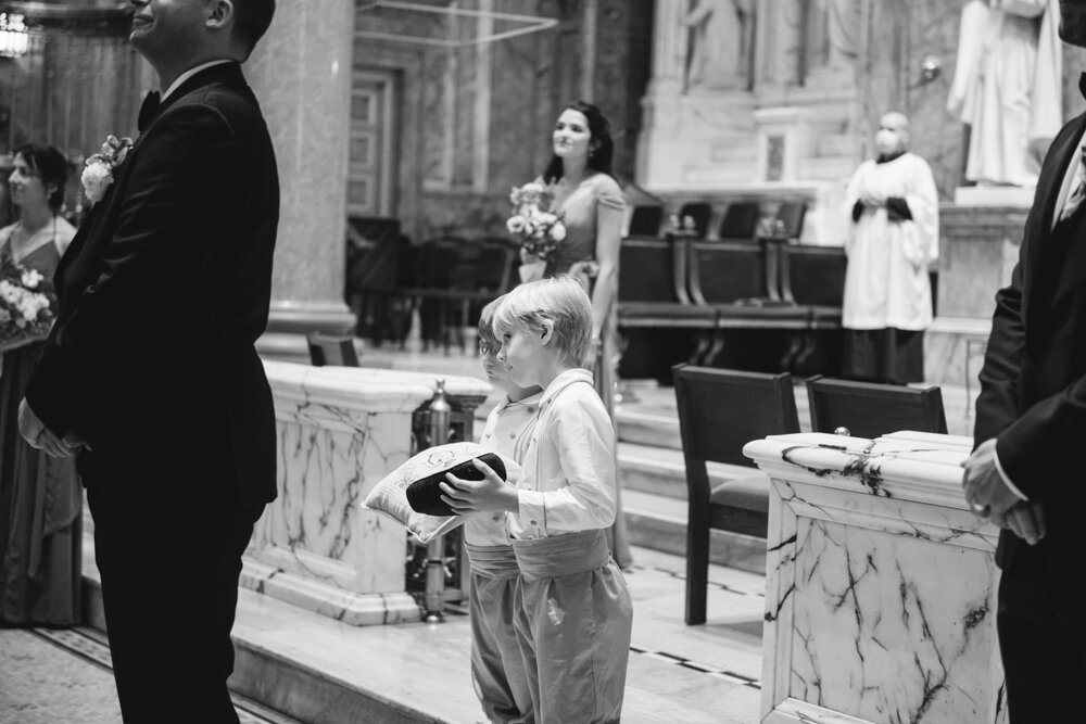 Ring-bearers stand behind the groom at the altar and lean to the side to get a glimpse of the bride.

Luxury Local Wedding NYC. Wedding in Manhattan. New York City Wedding Photographer. Manhattan Luxury Wedding Photography. Museum of the City of New York Weddings.