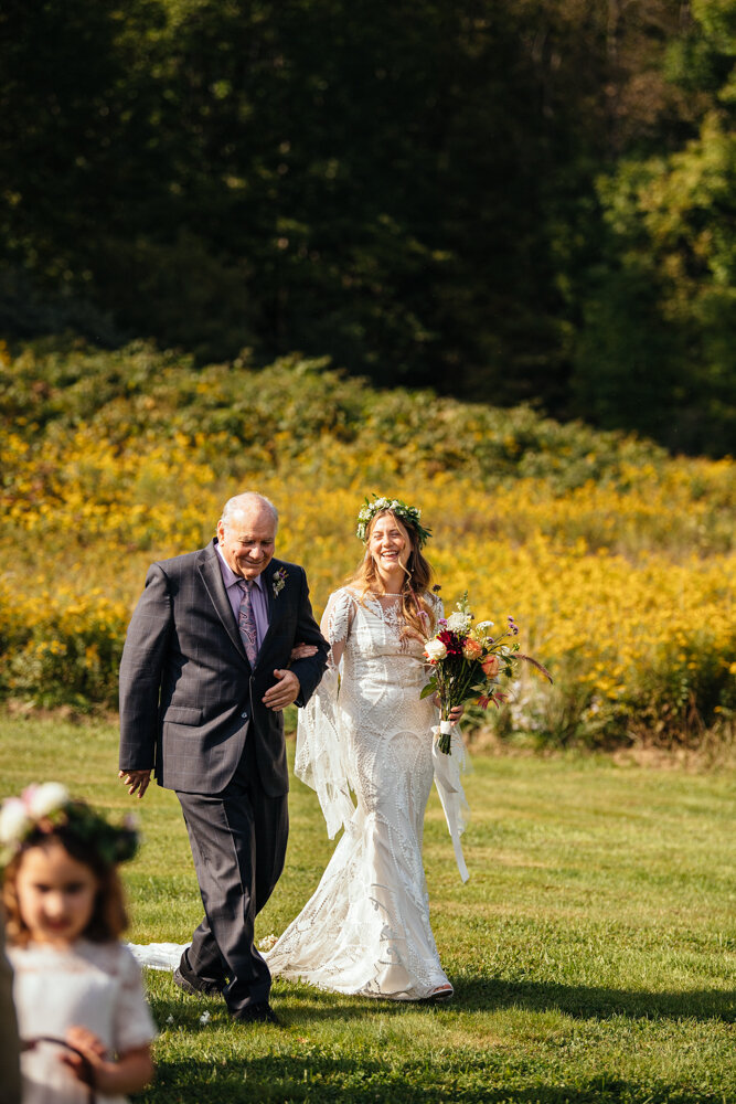 Bride and her father both smile as they walk down the aisle arm in arm.

Upstate New York Wedding Photographer. Upstate NY Wedding Photography. Luxury Local Wedding Upstate NY.