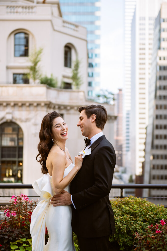 Bride and groom stand facing each other on a Manhattan terrace. Bride is laughing and groom is smiling at her.

University Club Wedding Photographer. Manhattan Luxury Wedding Photographer. Manhattan Bridal Portraits. Luxury Local Wedding NYC. 
