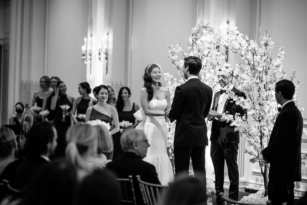 Bride and groom stand facing each other and holding hands at the altar.

University Club Wedding Photographer. Manhattan Luxury Wedding Photographer. Manhattan Bridal Portraits. Luxury Local Wedding NYC. 