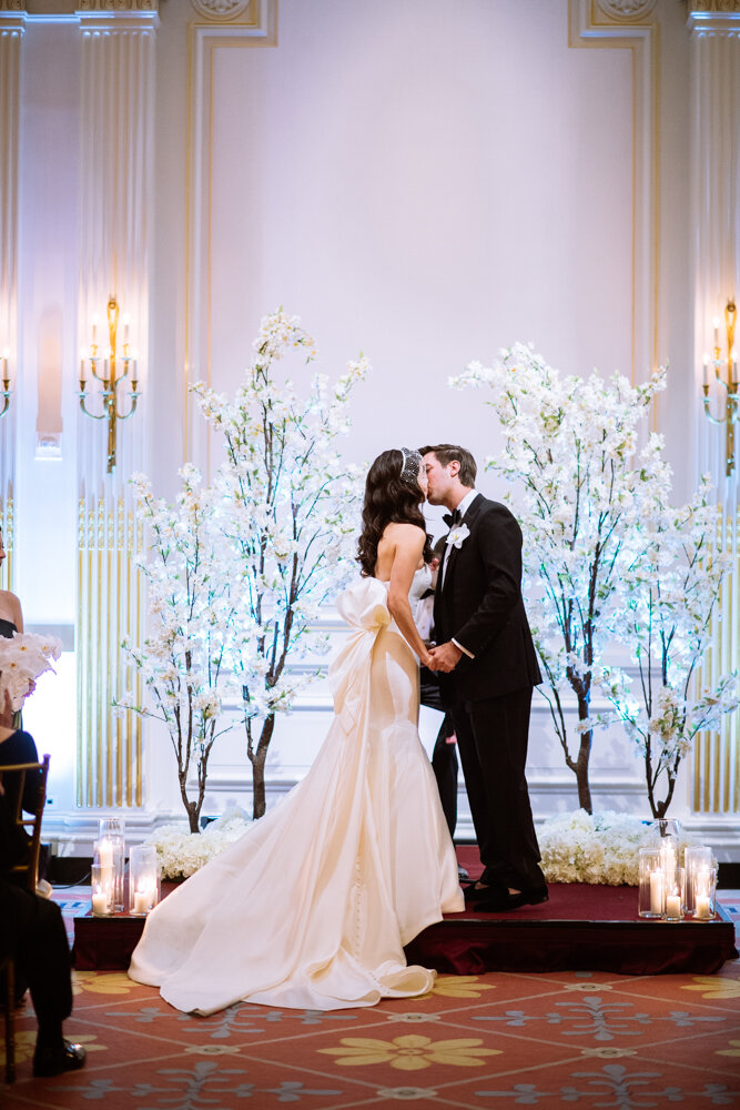 Bride and groom kiss at the altar.

University Club Wedding Photographer. Manhattan Luxury Wedding Photographer. Manhattan Bridal Portraits. Luxury Local Wedding NYC. 