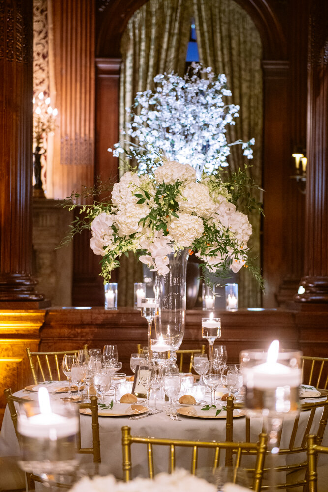 Photo of the table setting at the University Club in New York City. Gold chairs, wine glasses, and white floral arrangements.

University Club Wedding Photographer. Manhattan Luxury Wedding Photographer. Manhattan Bridal Portraits. Luxury Local Wedding NYC. 