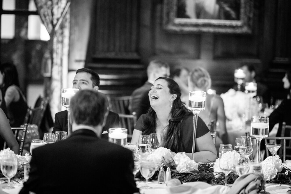 Wedding guests laugh while seated at tables at the wedding reception at the University Club in New York City.

University Club Wedding Photographer. Manhattan Luxury Wedding Photographer. Manhattan Bridal Portraits. Luxury Local Wedding NYC. 