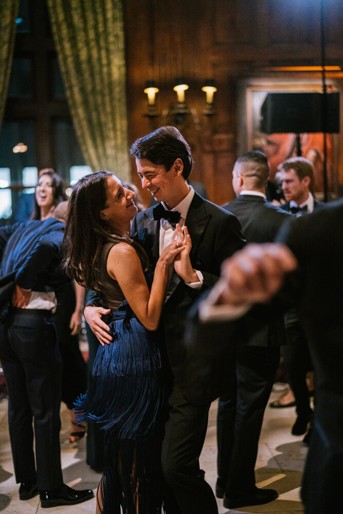 Man and woman dance in each other's arms on the dance floor at the wedding reception at the University Club in New York City.

University Club Wedding Photographer. Manhattan Luxury Wedding Photographer. Manhattan Bridal Portraits. Luxury Local Wedding NYC. 