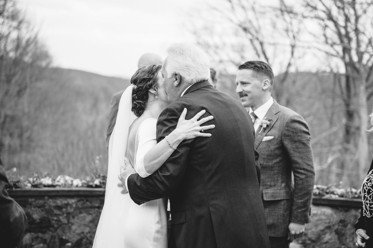 Bride and her father kiss on the cheek at the altar.
Upstate New York Wedding Photography. Cold Spring NY Wedding Photography. Luxury Local Wedding Photographer. Destination Wedding Photographer.