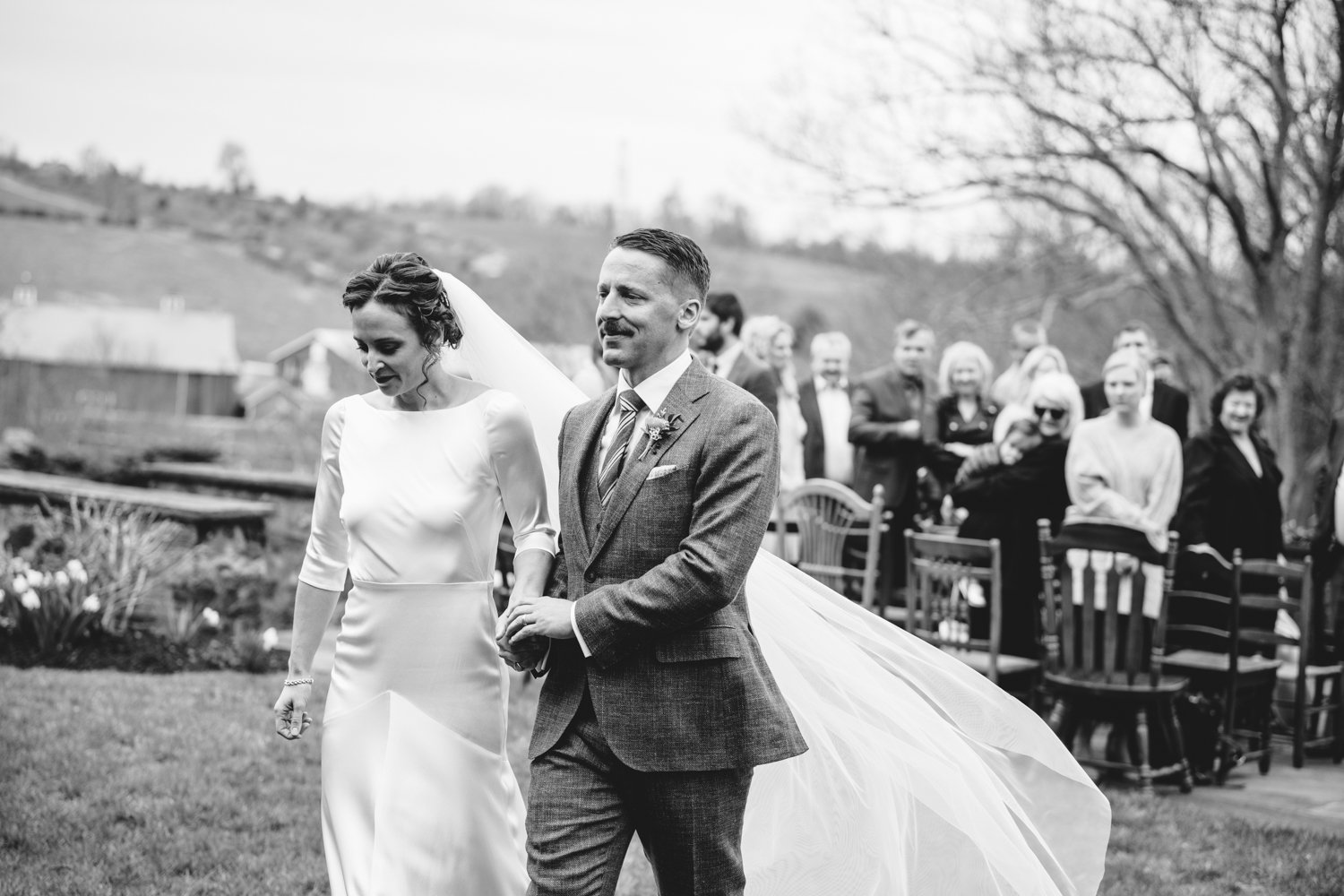 Bride and groom smile and holds hands as they process back down the aisle.

Upstate New York Wedding Photography. Cold Spring NY Wedding Photography. Luxury Local Wedding Photographer. Destination Wedding Photographer.