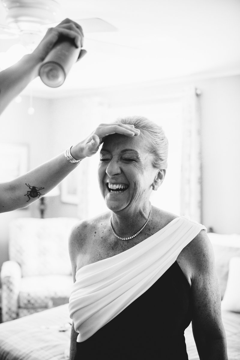 Woman smiling is getting her hair hairsprayed.

New York Wedding Photography. Long Island Wedding Photography. Luxury Local Wedding Photographer. Destination Wedding Photographer.