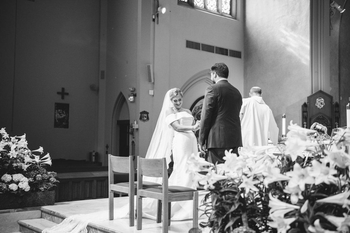 Bride and groom stand at the altar of the church facing each other and smiling.

New York Wedding Photography. Long Island Wedding Photography. Luxury Local Wedding Photographer. Destination Wedding Photographer.