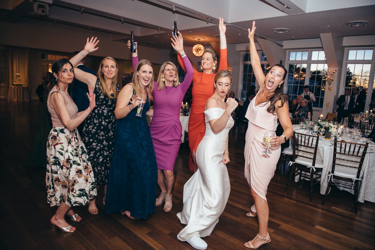 Bride and wedding guests stand with their hands in the air and smiles on their faces on the dance floor.

New York Wedding Photography. Long Island Wedding Photography. Luxury Local Wedding Photographer. Destination Wedding Photographer.