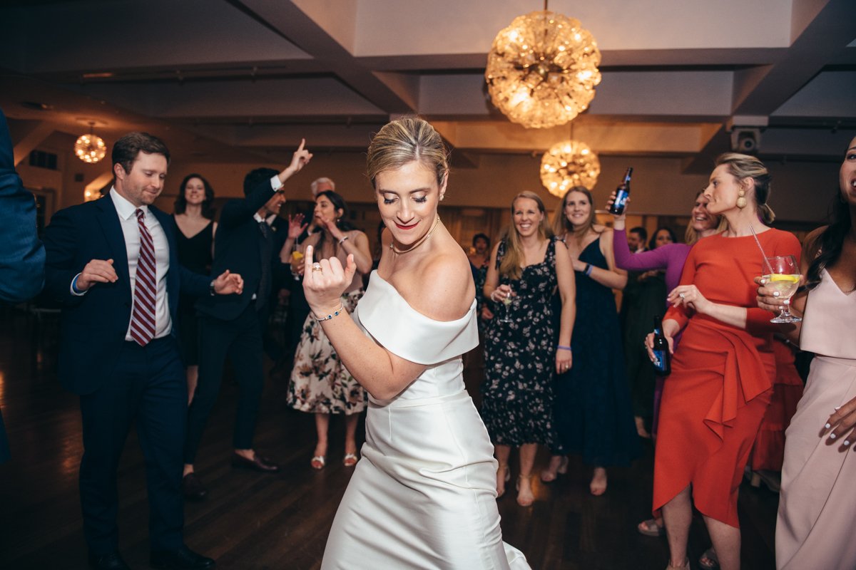Bride dances at her wedding reception surrounded by wedding guests.

New York Wedding Photography. Long Island Wedding Photography. Luxury Local Wedding Photographer. Destination Wedding Photographer.