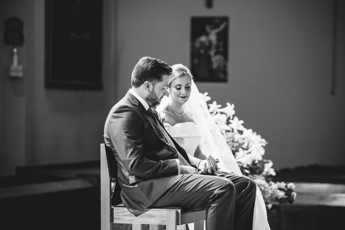 Bride and groom sit in chairs side by side, holding hands. They are looking down at their hands and smiling.

New York Wedding Photography. Long Island Wedding Photography. Luxury Local Wedding Photographer. Destination Wedding Photographer.