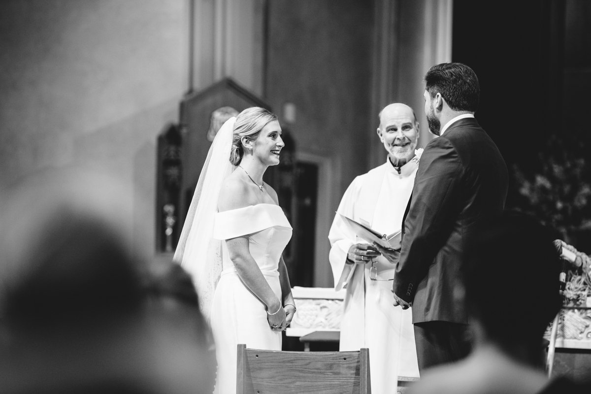 Bride and groom stand at the altar facing each other and smiling with the officiant looking at them and smiling.

New York Wedding Photography. Long Island Wedding Photography. Luxury Local Wedding Photographer. Destination Wedding Photographer.