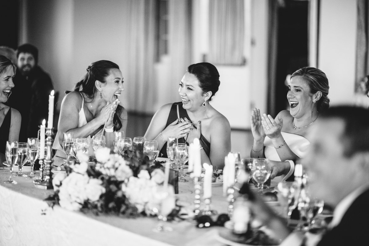Bride and bridesmaids clap and laugh while siting at a table at the wedding reception.

New York Wedding Photography. Long Island Wedding Photography. Luxury Local Wedding Photographer. Destination Wedding Photographer.