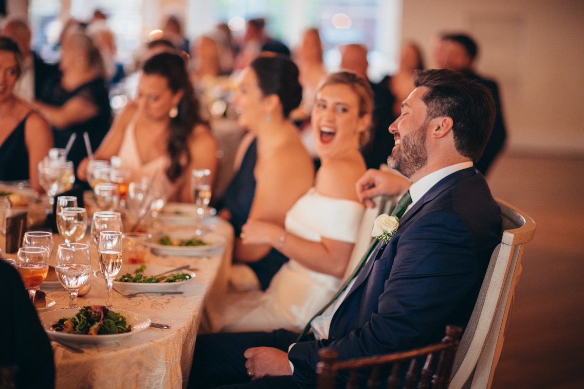 Bride looks at the groom sitting next to her and they both laugh.

New York Wedding Photography. Long Island Wedding Photography. Luxury Local Wedding Photographer. Destination Wedding Photographer.