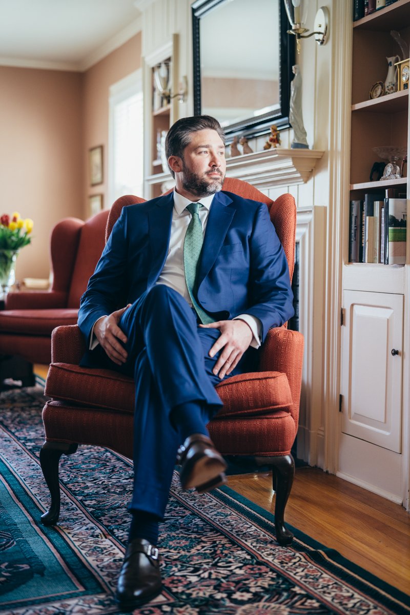 Groom sits in a red armchair in a blue suit and green tie and looks out the window.

New York Wedding Photography. Long Island Wedding Photography. Luxury Local Wedding Photographer. Destination Wedding Photographer.