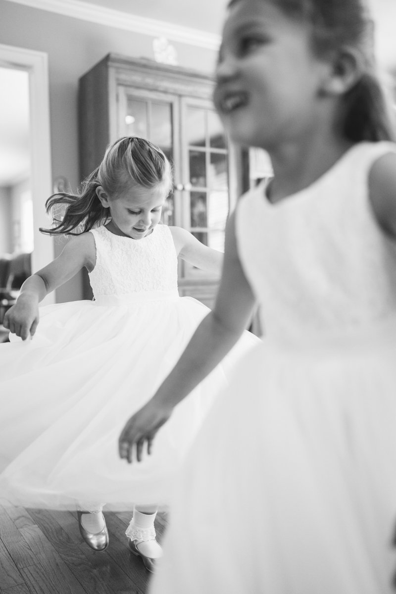 Two flower girls dance around in a room with big smiles.

New York Wedding Photography. Long Island Wedding Photography. Luxury Local Wedding Photographer. Destination Wedding Photographer.