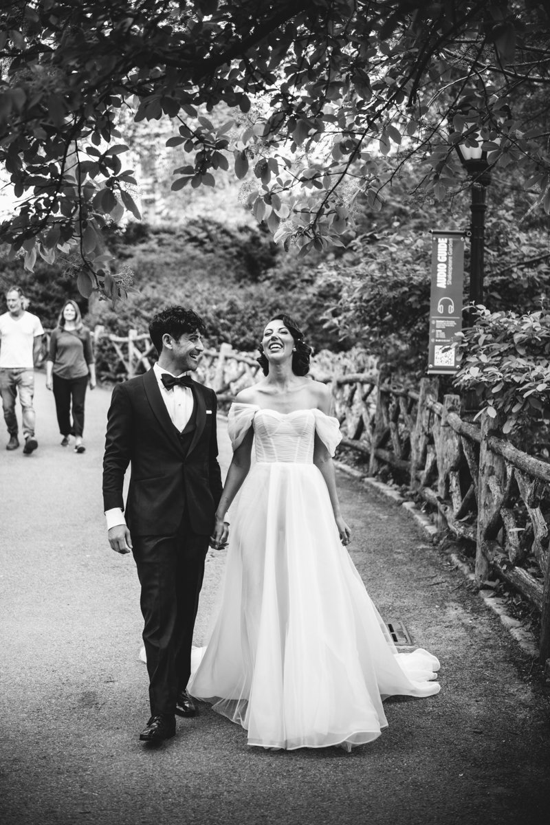 Bride and groom walk hand and hand in the park, laughing and smiling.

Manhattan Wedding Photographer. New York Wedding Photographer. New York Historical Society Wedding. NY Historical Society Weddings.