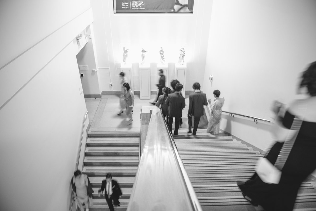 Motion-blurred photo of wedding guests descending the stairs of the New York Historical Society in Manhattan.

Manhattan Wedding Photographer. New York Wedding Photographer. New York Historical Society Wedding. NY Historical Society Weddings.