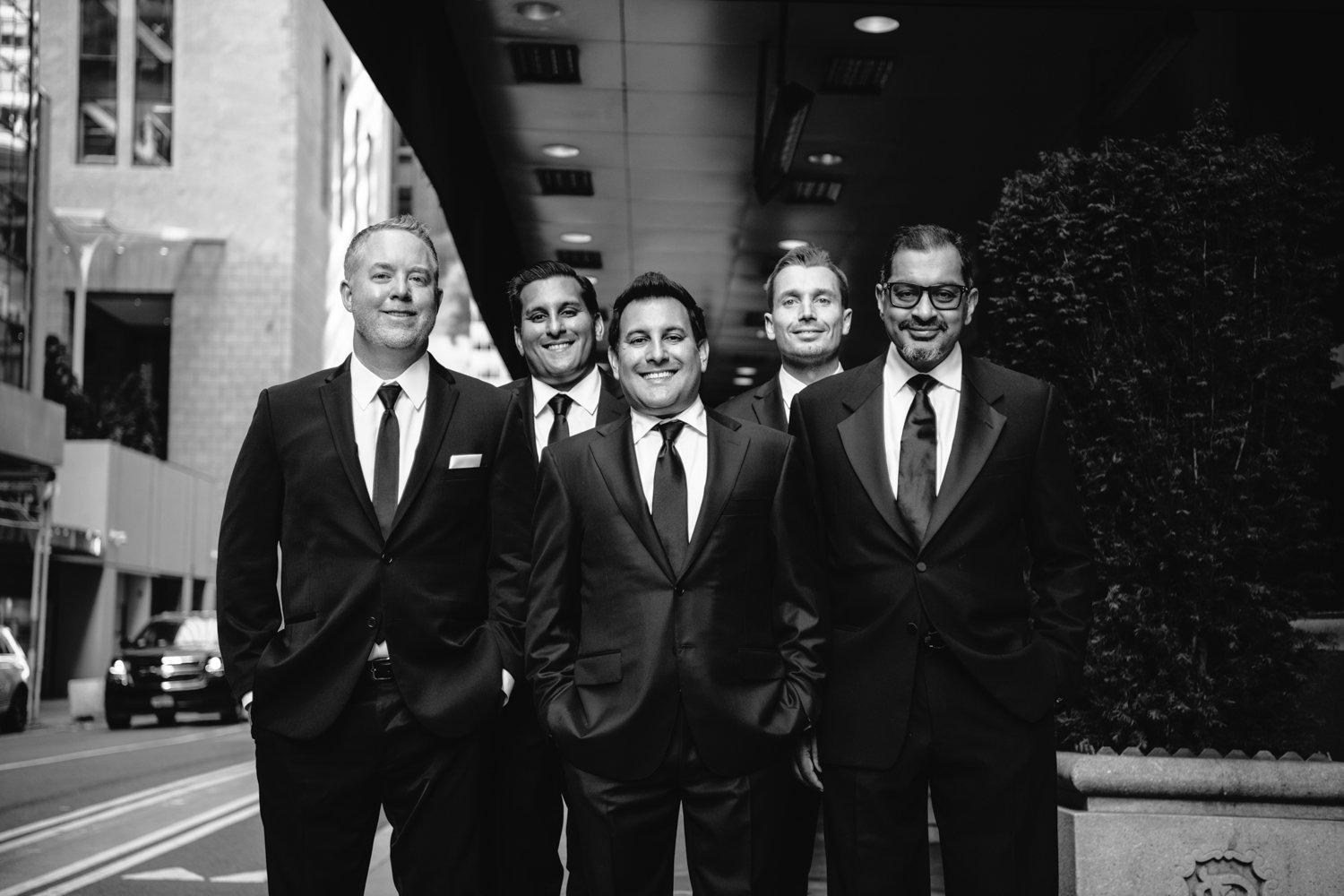 Groom and his groomsmen stand on the sidewalk outside the St. Regis in Manhattan and smile at the camera.

Manhattan Luxury Wedding. New York Luxury Wedding Photographer. Wedding in Manhattan. NYC Luxury Wedding.