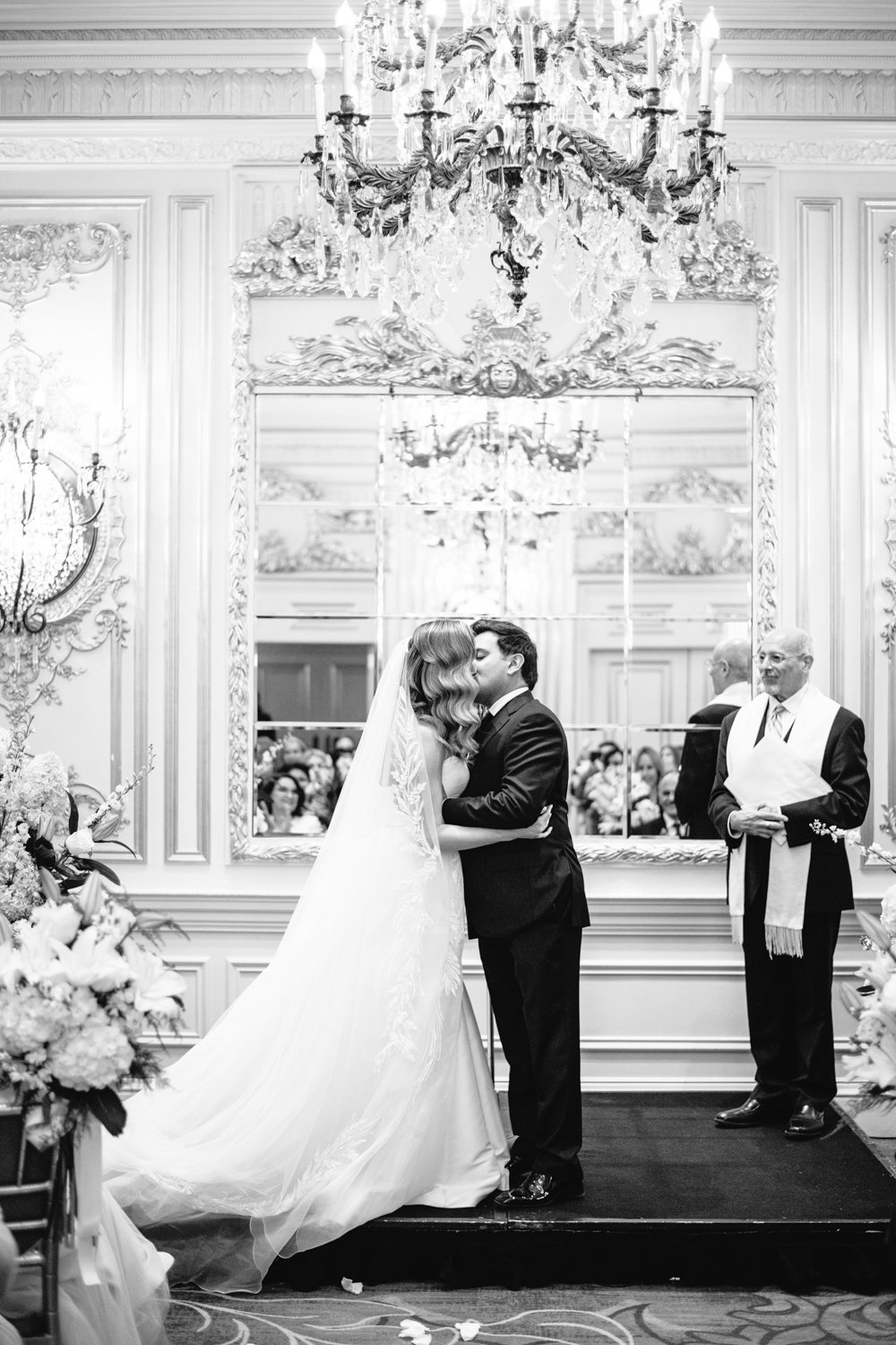 Bride and groom kiss at the altar below a grand chandelier in the St. Regis in Manhattan.

Manhattan Luxury Wedding. New York Luxury Wedding Photographer. Wedding in Manhattan. NYC Luxury Wedding.