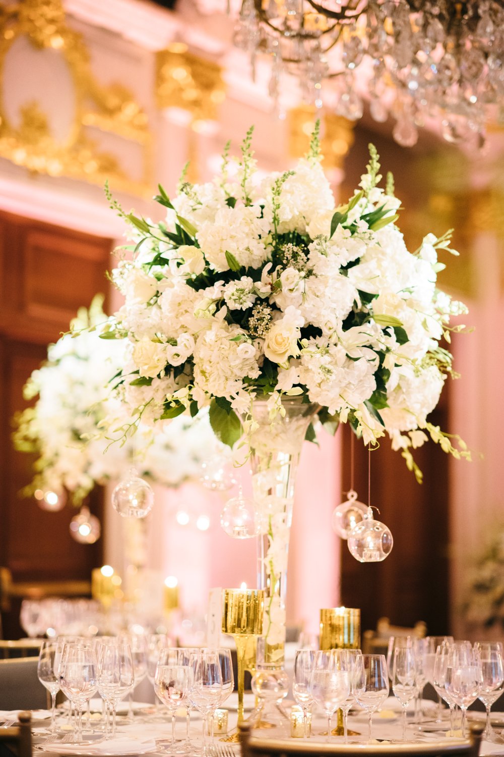 White flowers with green accents are in a vase on a table, surrounded by wine glasses.

Manhattan Luxury Wedding. New York Luxury Wedding Photographer. Wedding in Manhattan. NYC Luxury Wedding.