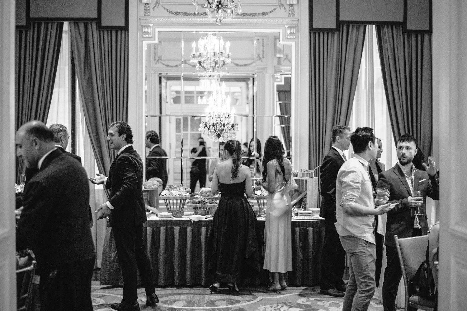 Wedding guests mingle and stand in front of a table with food at the St. Regis.

Manhattan Luxury Wedding. New York Luxury Wedding Photographer. Wedding in Manhattan. NYC Luxury Wedding.