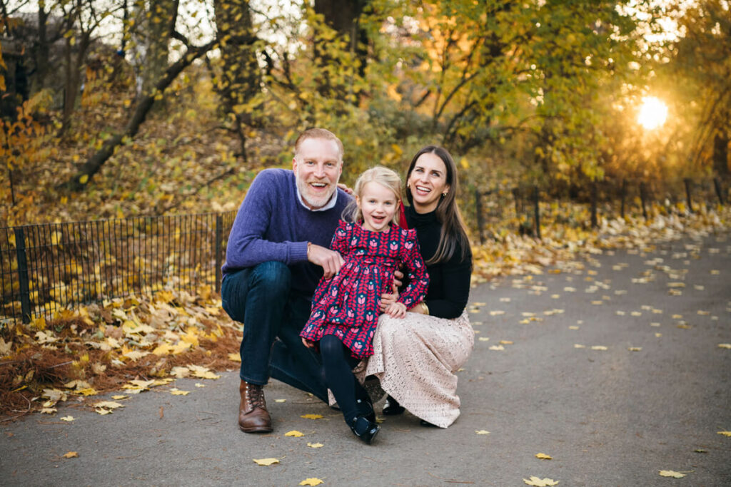 Man and woman crouch down next to their daughter and smile at the camera. Photographed in Central Park.

Manhattan Family Portraits. Central Park Family Photography. NYC Family Photographer.