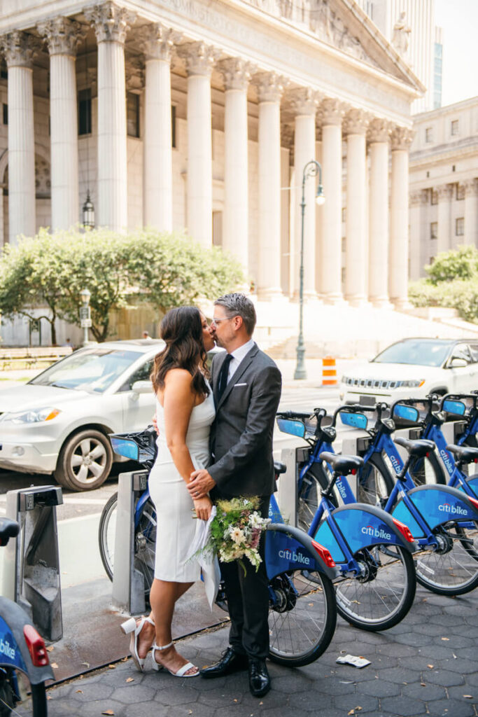 Man and woman face each other and kiss in front of a rack of Citi bikes.

NYC Engagement Portraits. Manhattan Engagement Photographer. 