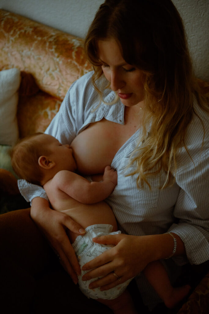 Mother photographed breastfeeding her newborn baby.

Newborn Photography. Austin Newborn Photographer. Lifestyle Newborn Portraits. Austin Baby Portraits. Austin Famly Photography.