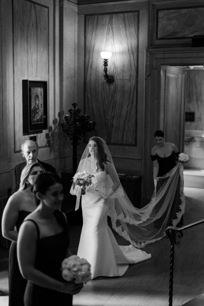 Bride is waiting inside the church for the procession. Black and white photograph.

Luxury NYC Wedding Photography. Manhattan Luxury Wedding Photographer. NYC Luxury Wedding. University Club Wedding Photographer.