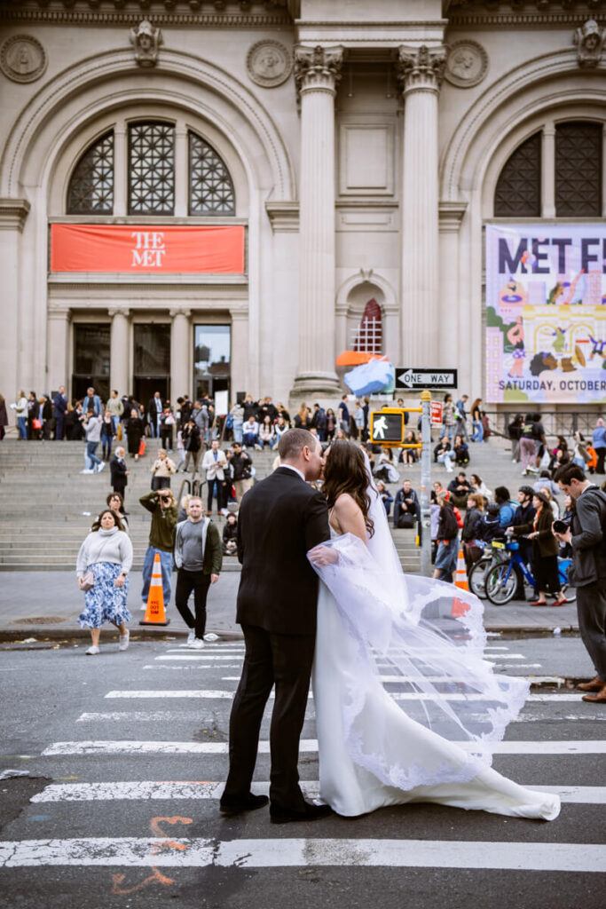 Bride and groom kiss on the crosswalk in front of the Metropolitan Museum of Art in Manhattan.

Luxury NYC Wedding Photography. Manhattan Luxury Wedding Photographer. NYC Luxury Wedding. University Club Wedding Photographer.