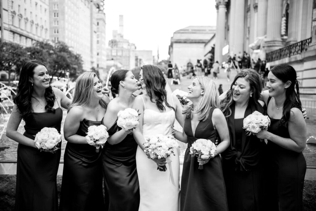 Bride and her bridesmaids look at each other and smile and laugh with bouquets in hand. The Metropolitan Museum of Art is in the background.

Luxury NYC Wedding Photography. Manhattan Luxury Wedding Photographer. NYC Luxury Wedding. University Club Wedding Photographer. 5th Avenue Bridal Party Portraits.