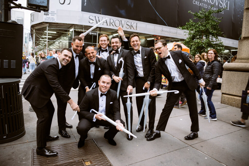 Groom and groomsmen are posting casually and laughing on the sidewalk in Manhattan.

Luxury NYC Wedding Photography. Manhattan Luxury Wedding Photographer. NYC Luxury Wedding. University Club Wedding Photographer. 5th Avenue Bridal Party Portraits.