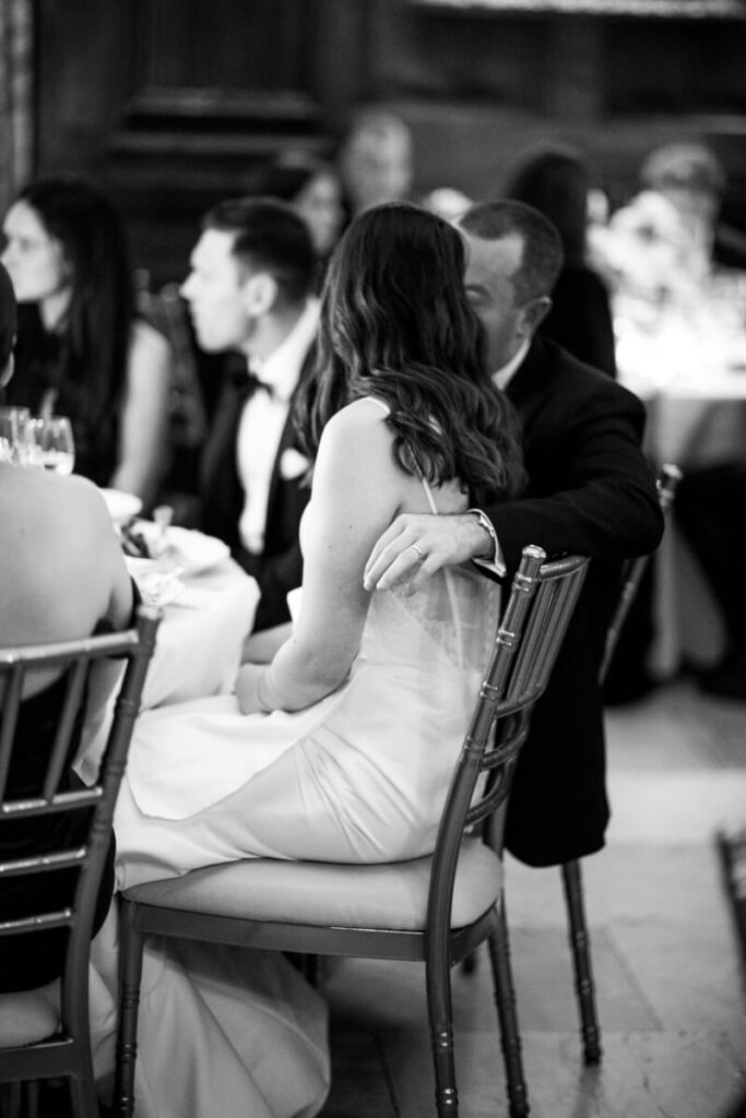 Bride and groom are seated at a table at their reception at the University Club in Manhattan. Black and white photograph. 

Luxury NYC Wedding Photography. Manhattan Luxury Wedding Photographer. NYC Luxury Wedding. University Club Wedding Photographer.