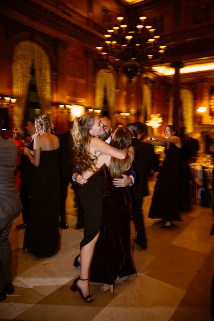 Wedding guests dancing in the University Club in Manhattan.

Luxury NYC Wedding Photography. Manhattan Luxury Wedding Photographer. NYC Luxury Wedding. University Club Wedding Photographer.