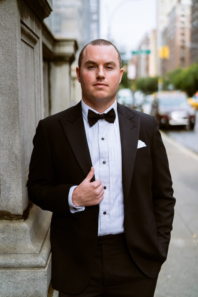 Groom is leaning on a wall on the streets of Manhattan, wearing a tuxedo.

Luxury NYC Wedding Photography. Manhattan Luxury Wedding Photographer. NYC Luxury Wedding. University Club Wedding Photographer. 5th Avenue Groom Portraits.
